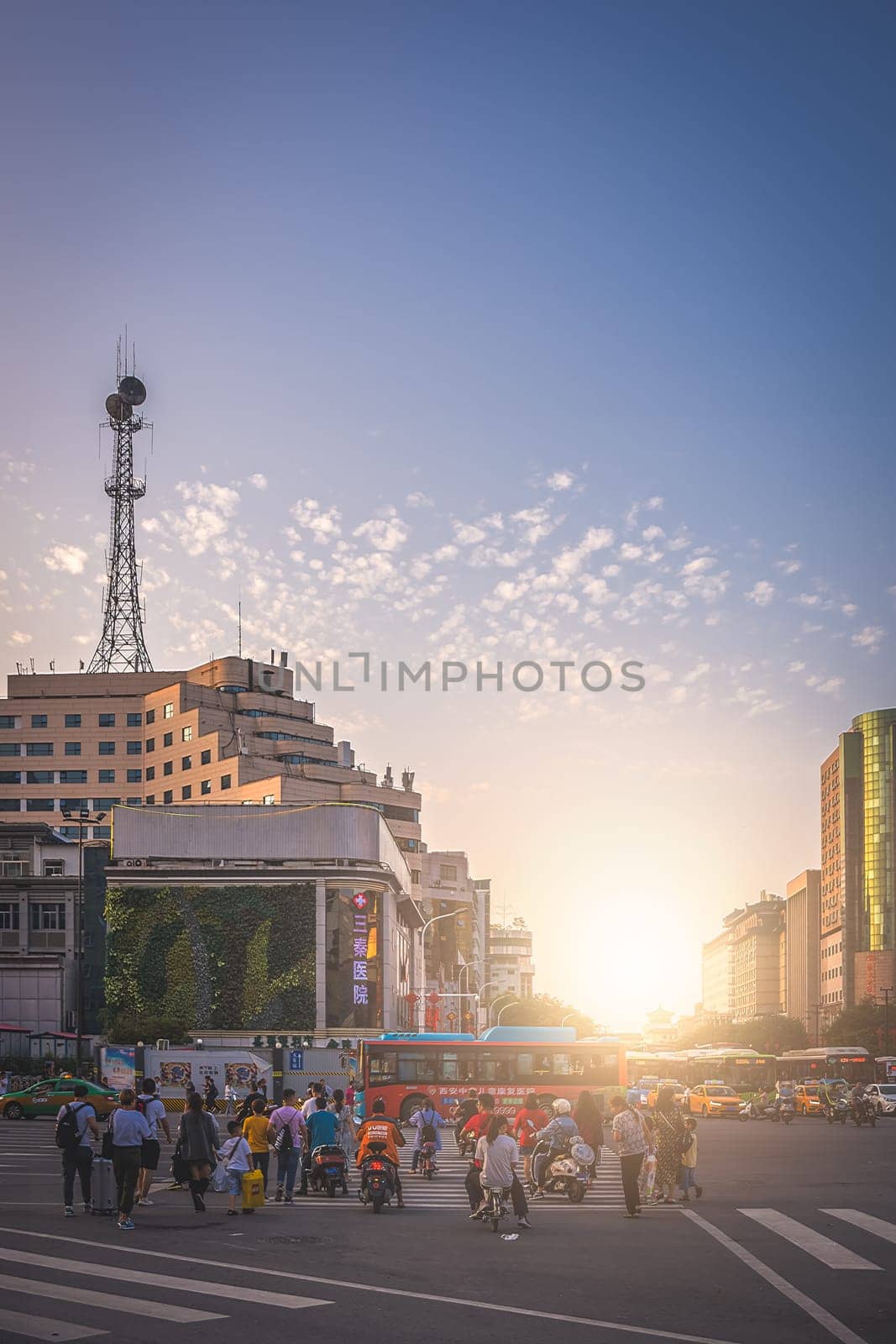 Xian, China -  August 2019 : Crowd of people crossing the busy street in the city of Xian in summer, Shaanxi Province