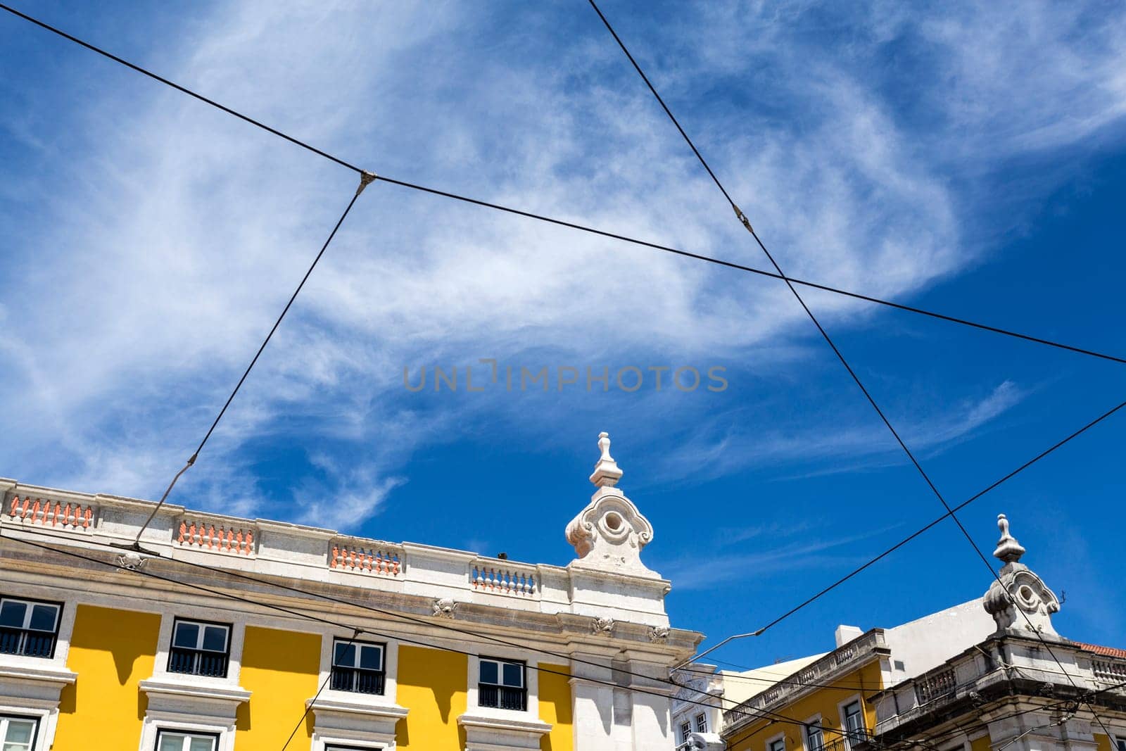 Detail of the elegant classic pombaline government buildings flanking three sides of the huge Commerce Square built after the 1755 earthquake in Lisbon, Portugal