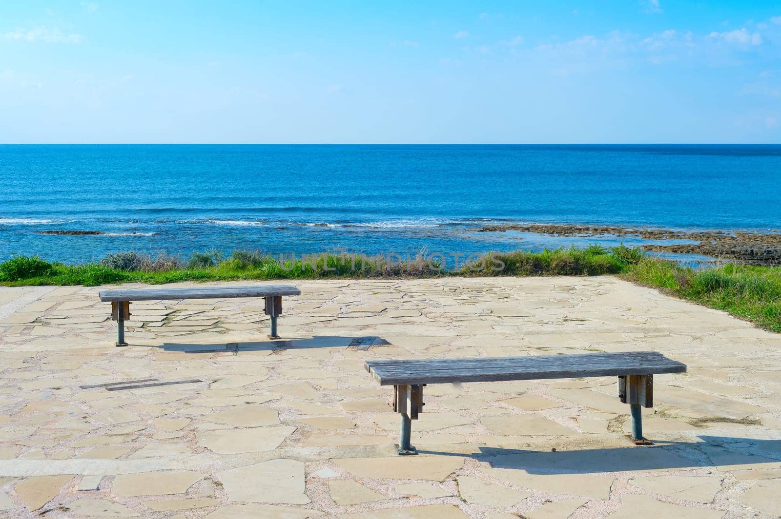 Empty benches by the sea. Paphos, Cyprus