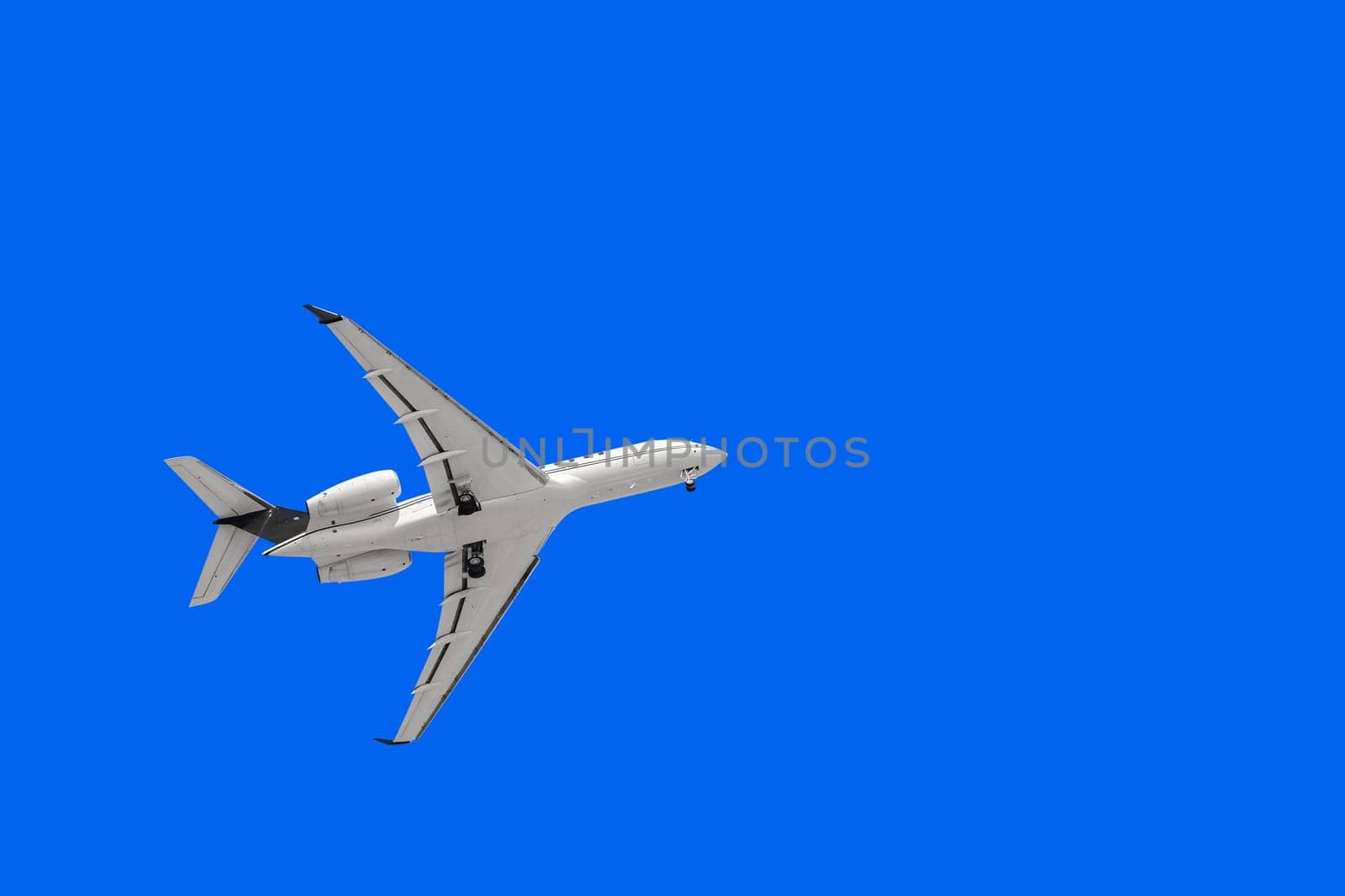 White Plane with Landing Gear in the Sky