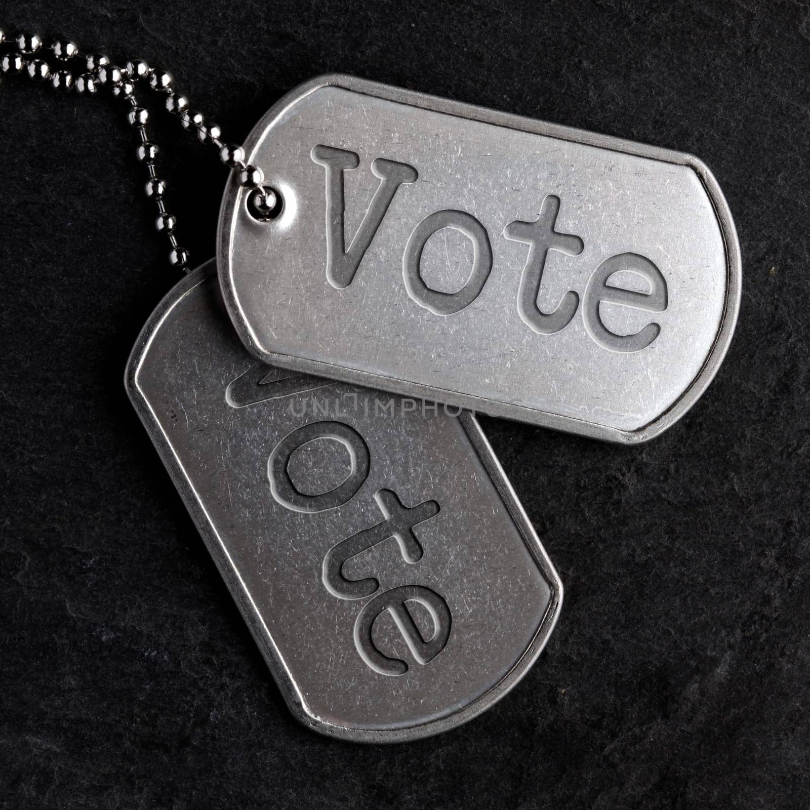 Old and worn military dog tags - Vote