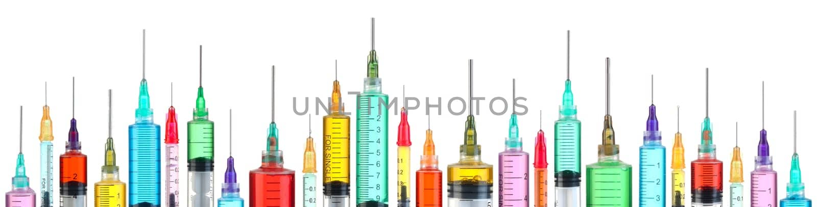 Row of bright colorful syringes