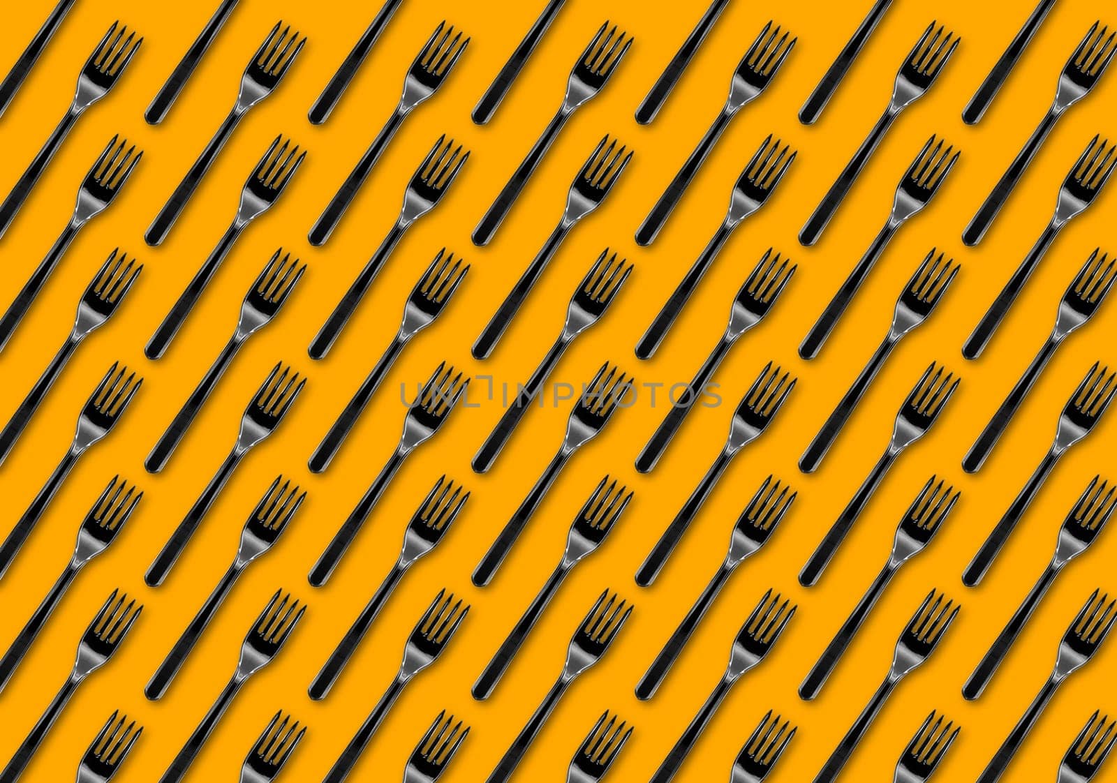Many black plastic forks on blue background, top view. Disposable table wear concept. Creative top view pattern.