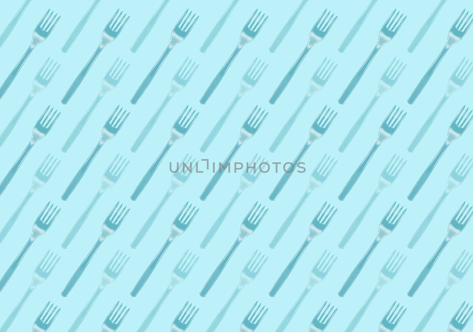 Many black plastic forks on blue background, top view. Disposable table wear concept. Creative top view pattern.