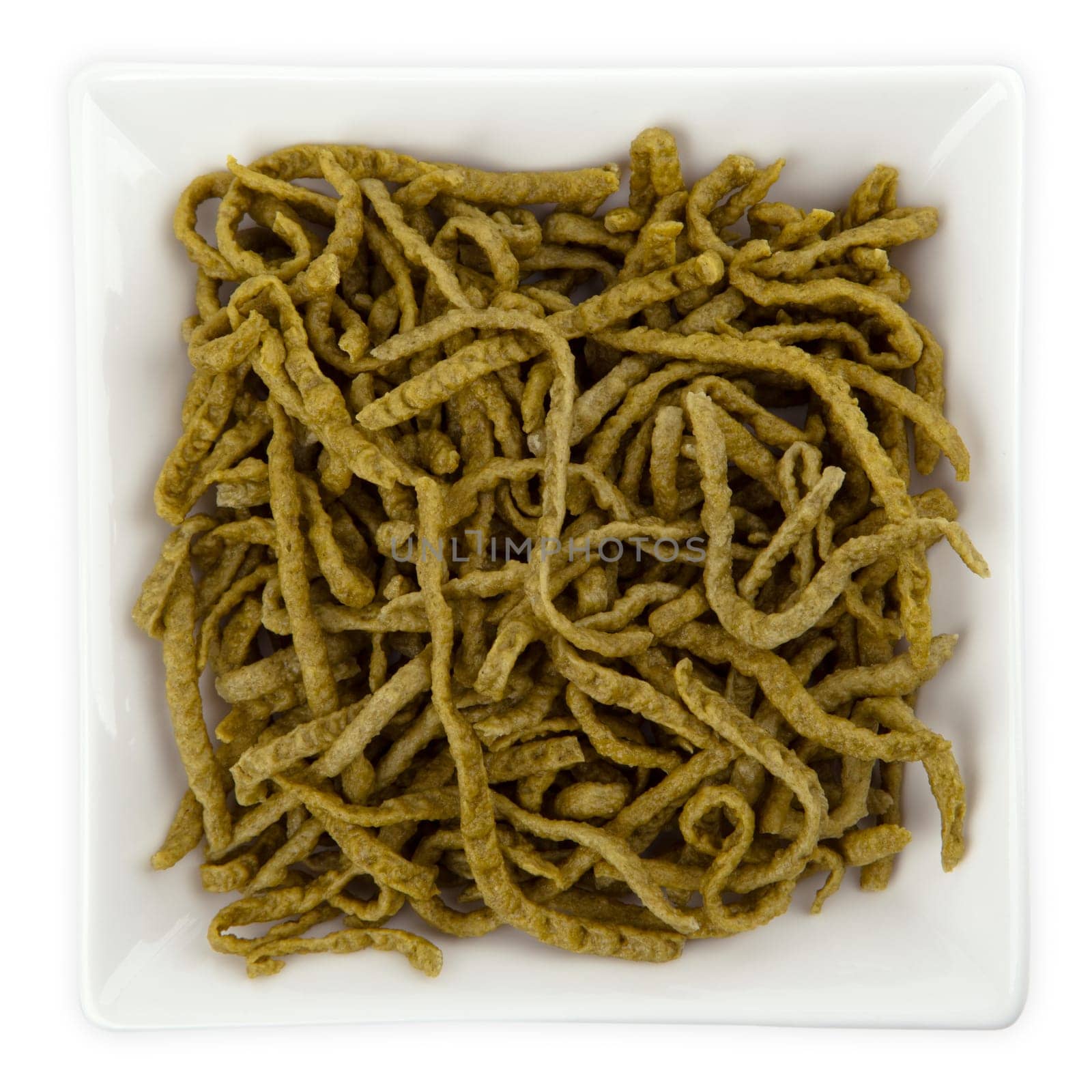 Raw Spinach Noodles in a bowl isolated on white background