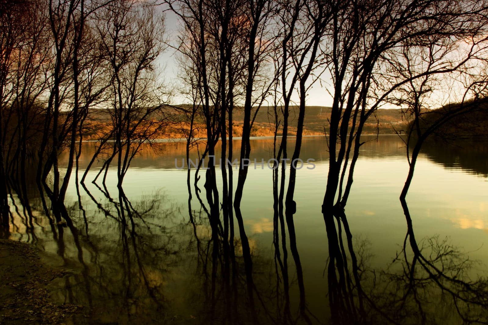 autumn flood at the lake at sunset, north of spain