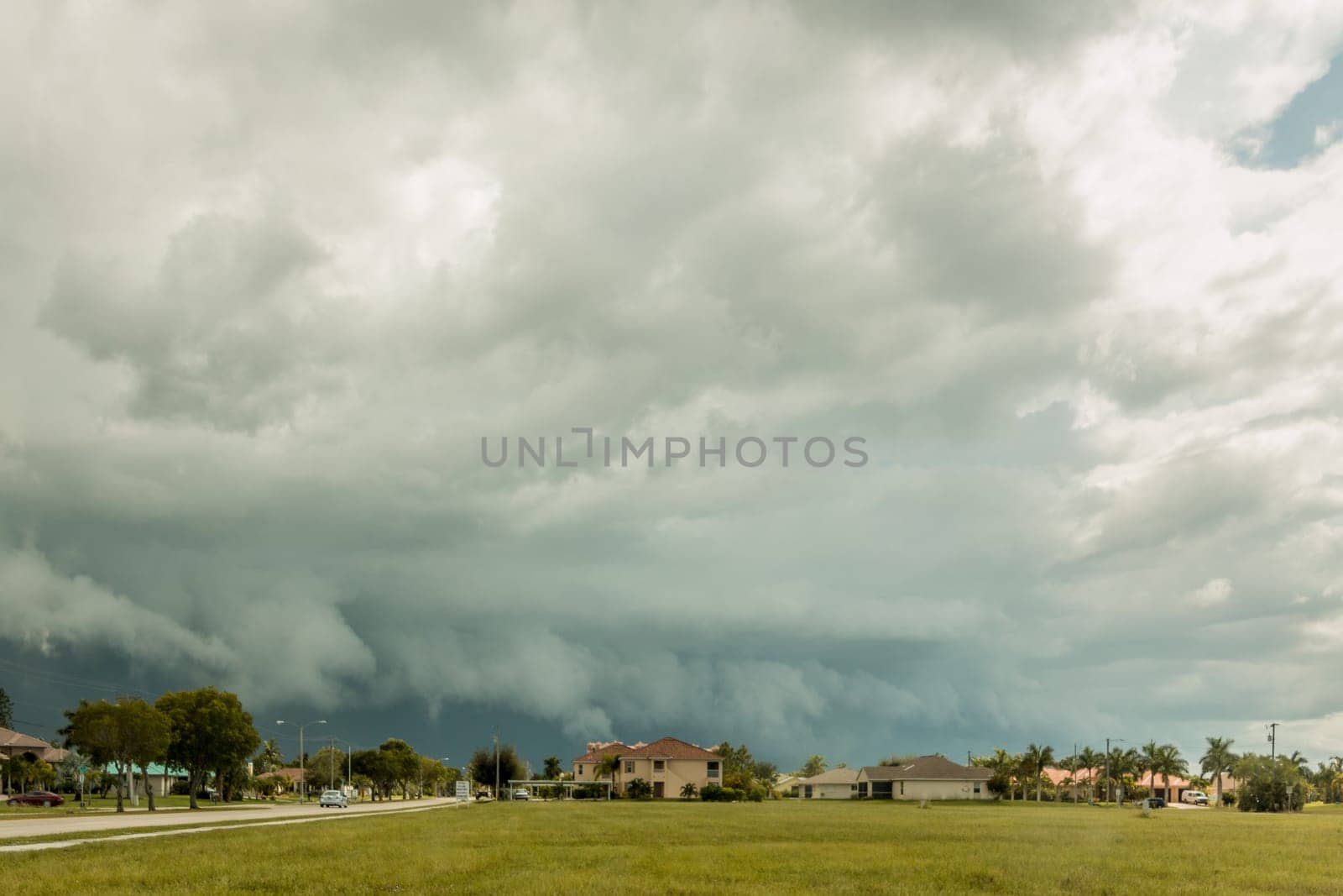Dark stormy clouds carrying heavy rainfall on a typical summer day in Cape Coral Florida