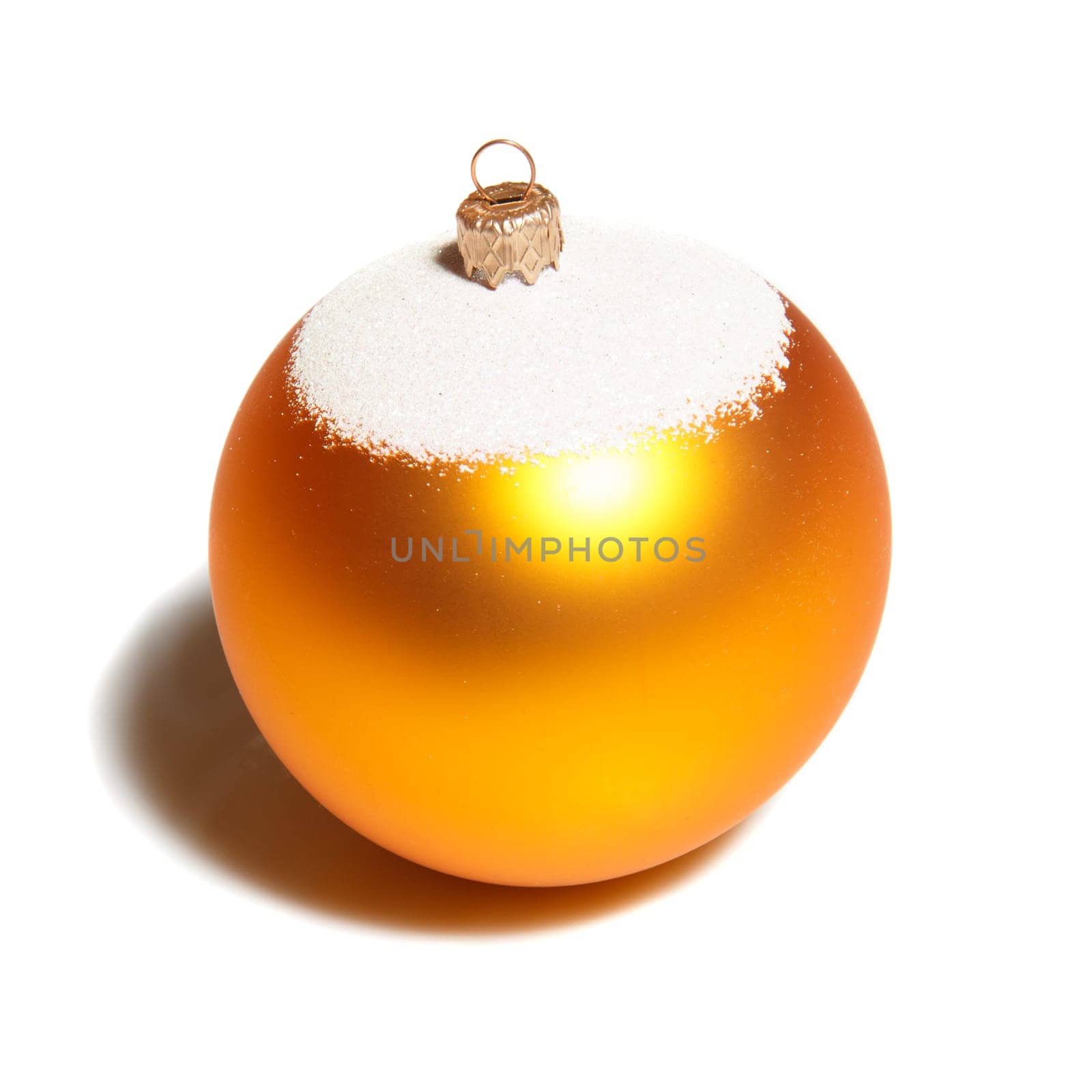 A yellow ball shaped chirstmas decoration on white background