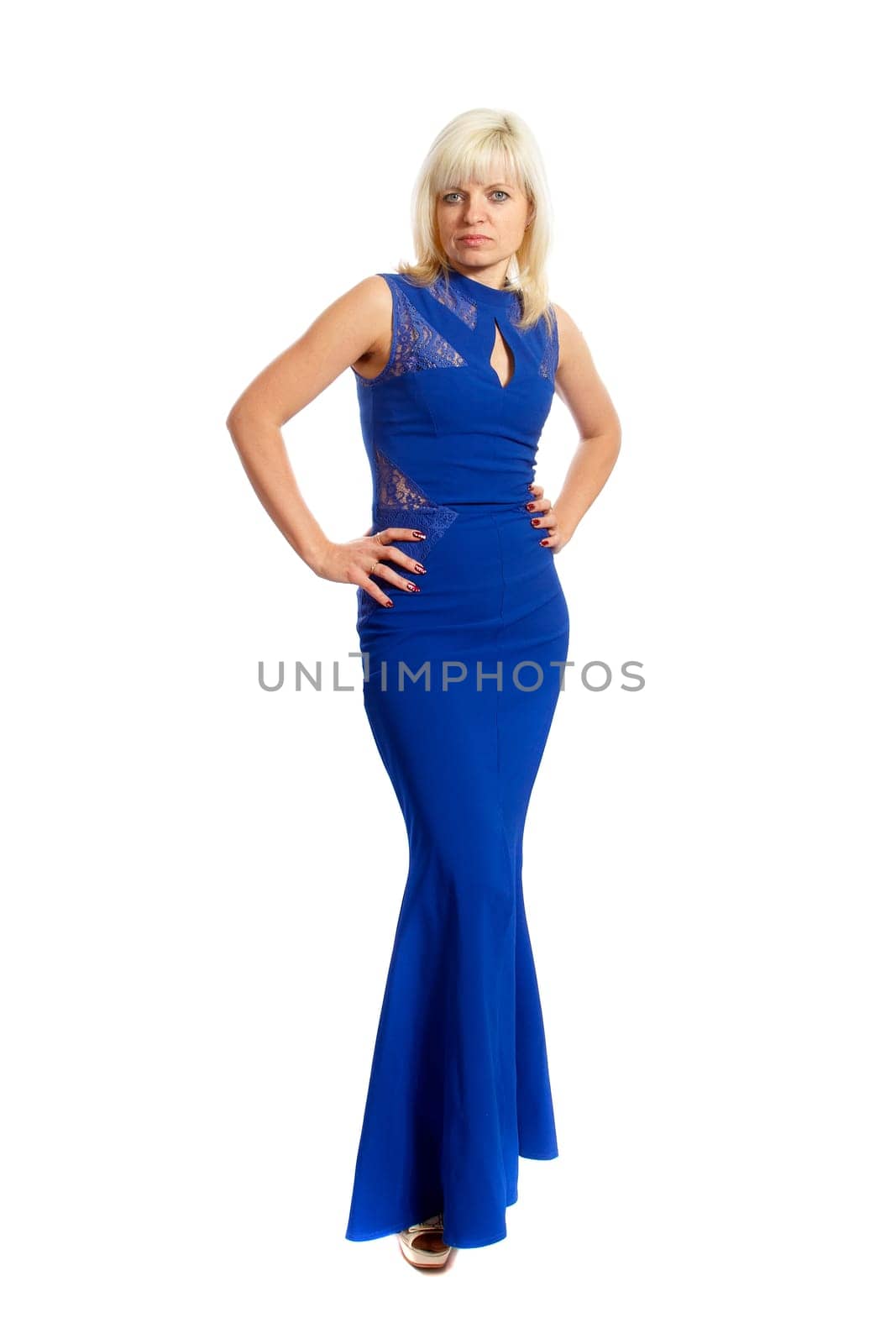 A smiling blond woman wearing a blue dress