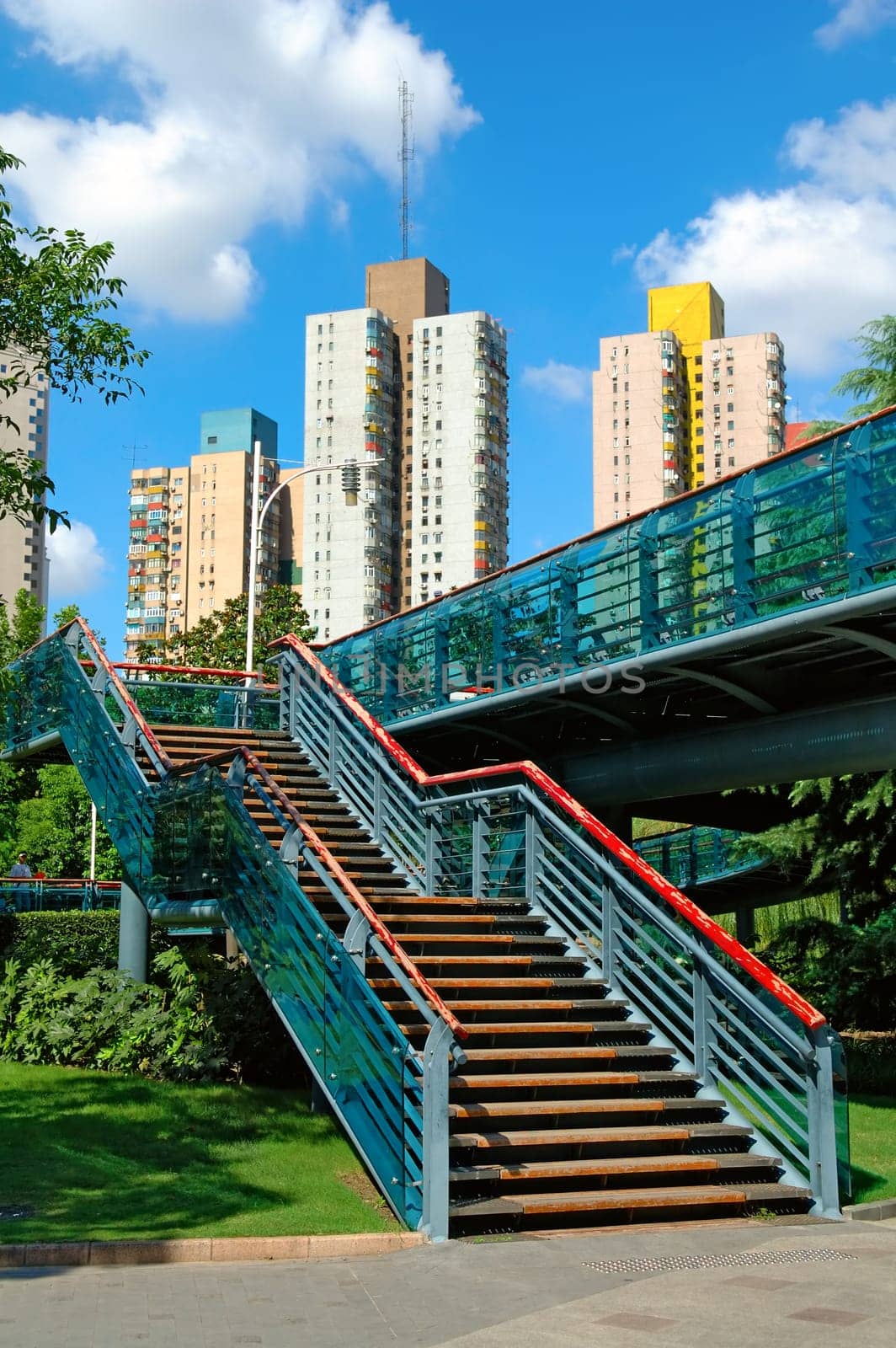 The view of stairs of an overbridge in a city park