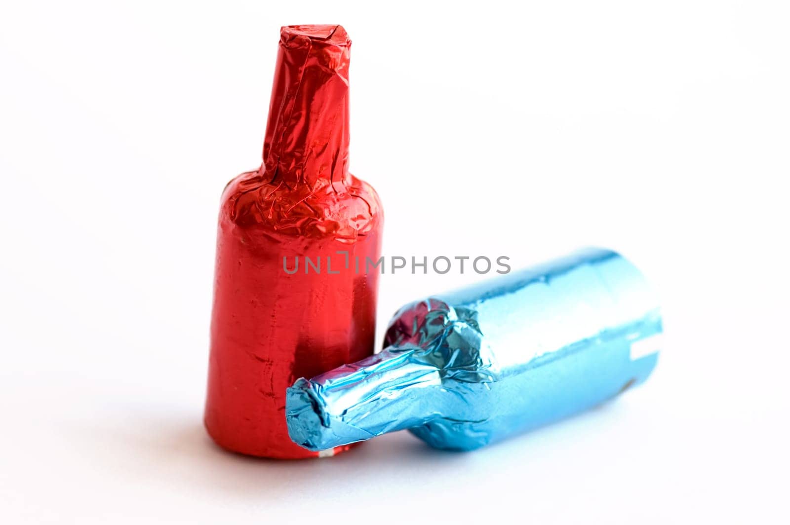 Close up view of colorful chocolate bottles