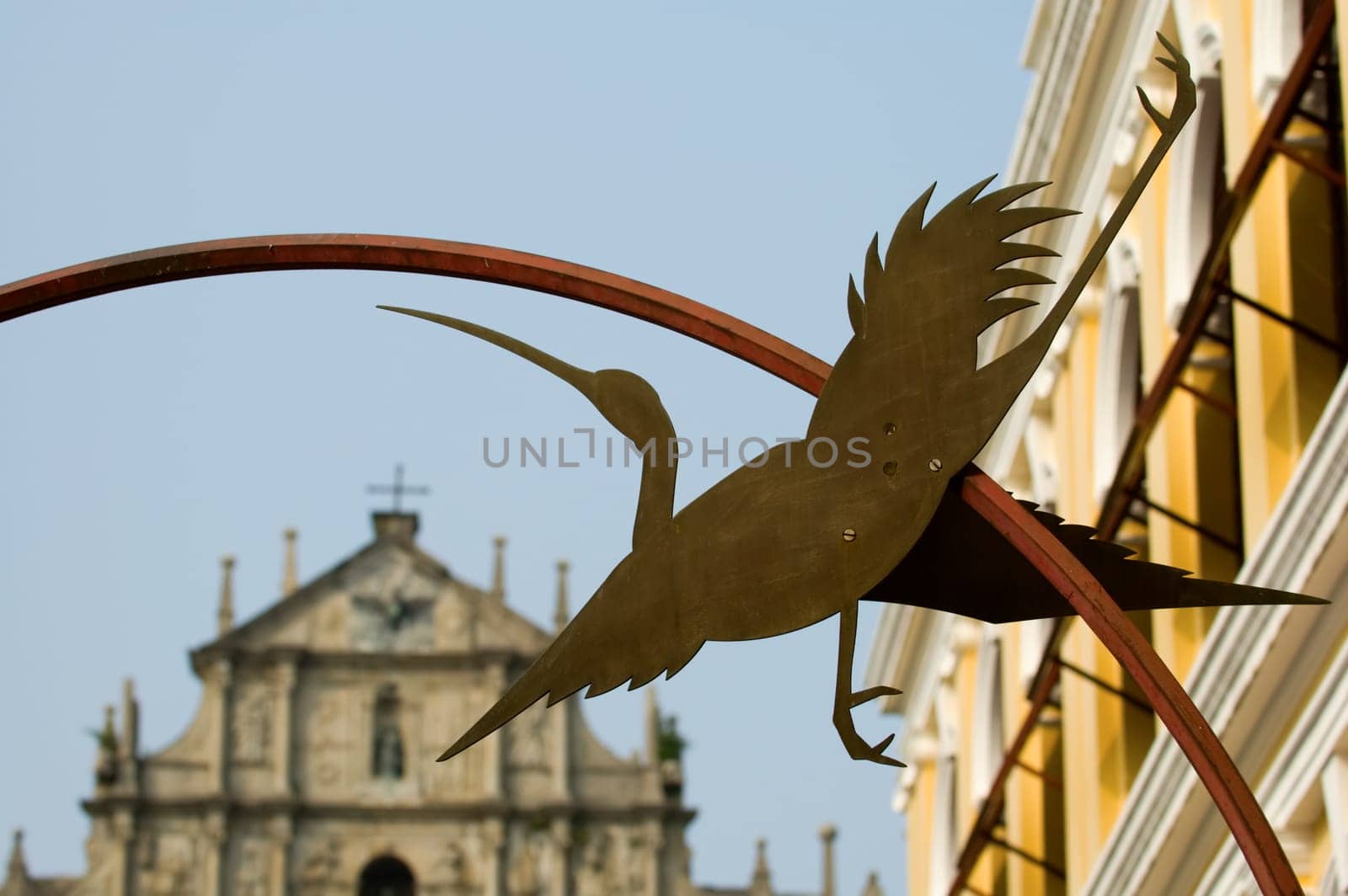 Statue of egret and Ruins of St Paul's Cathedral, Macau