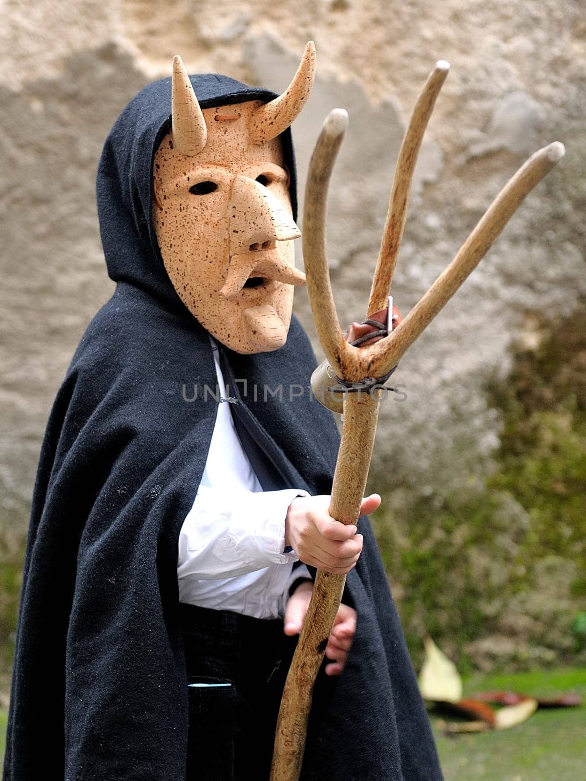Orani, Sardinia, Italy - February 15, 2015: Parade of traditional masks of Sardinia during the Carnival 2015 in Orani.