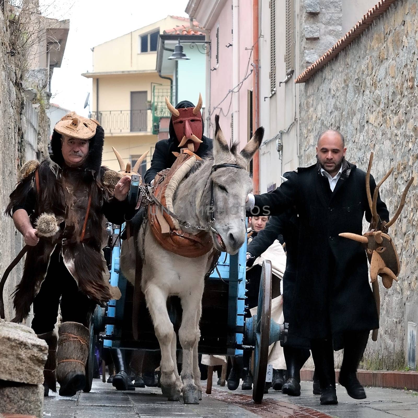 Orani, Sardinia, Italy - February 15, 2015: Parade of traditional masks of Sardinia during the Carnival 2015 in Orani.