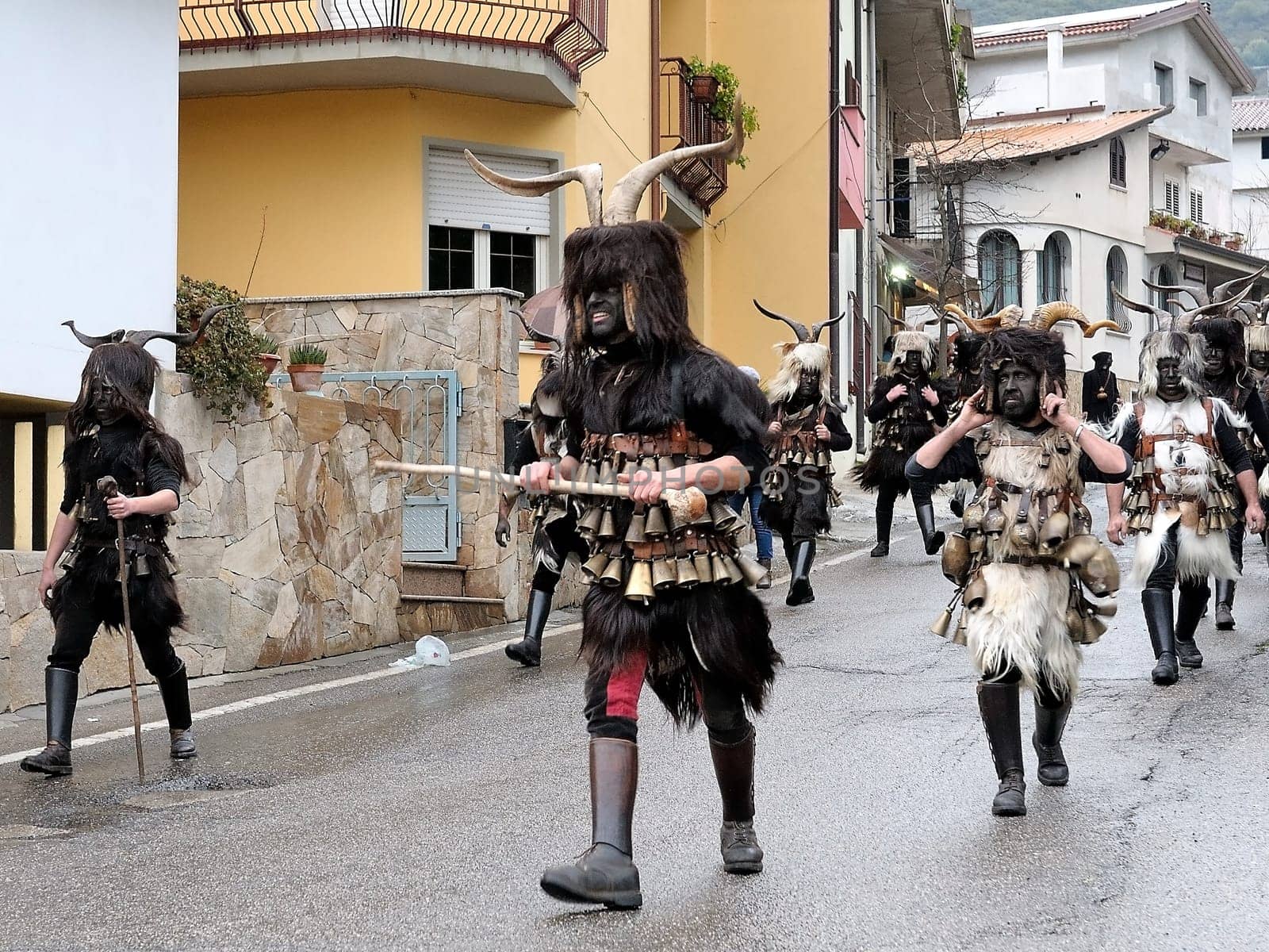 Orani, Sardinia, Italy - February 15, 2015: Parade of traditional masks of Sardinia during the Carnival 2015 in Orani.