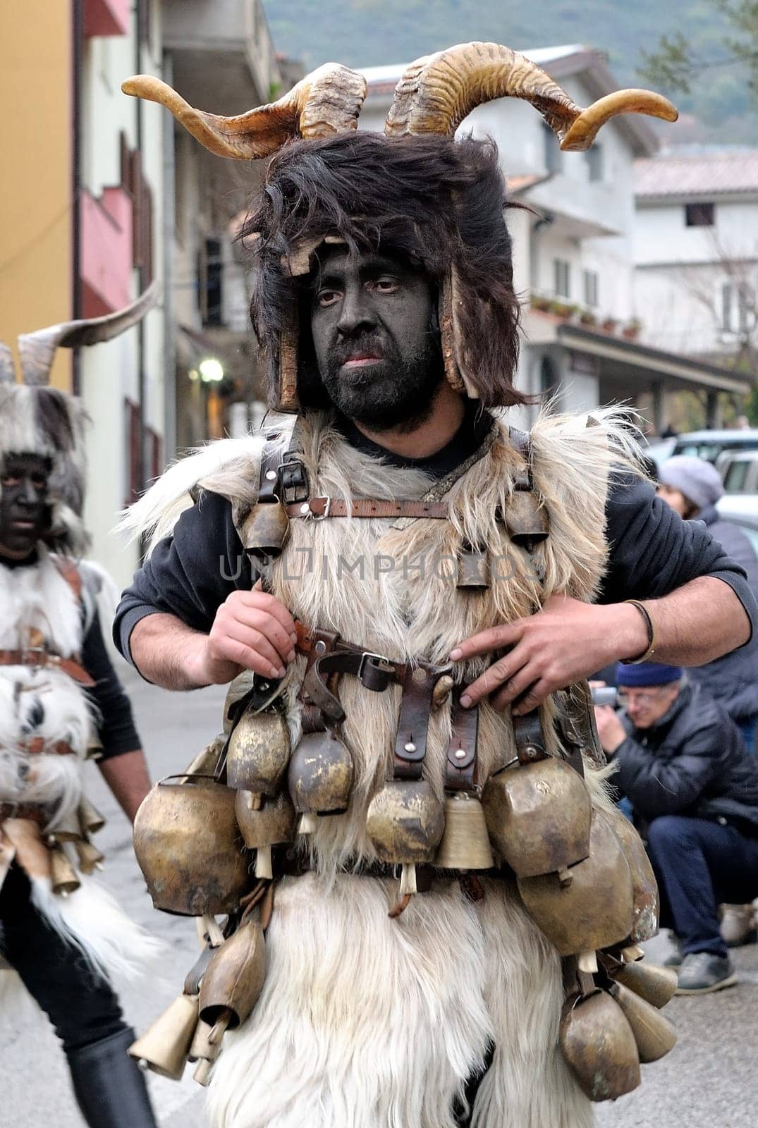 Orani, Sardinia, Italy - February 15, 2015: Parade of traditional masks of Sardinia during the Carnival 2015 in Orani.