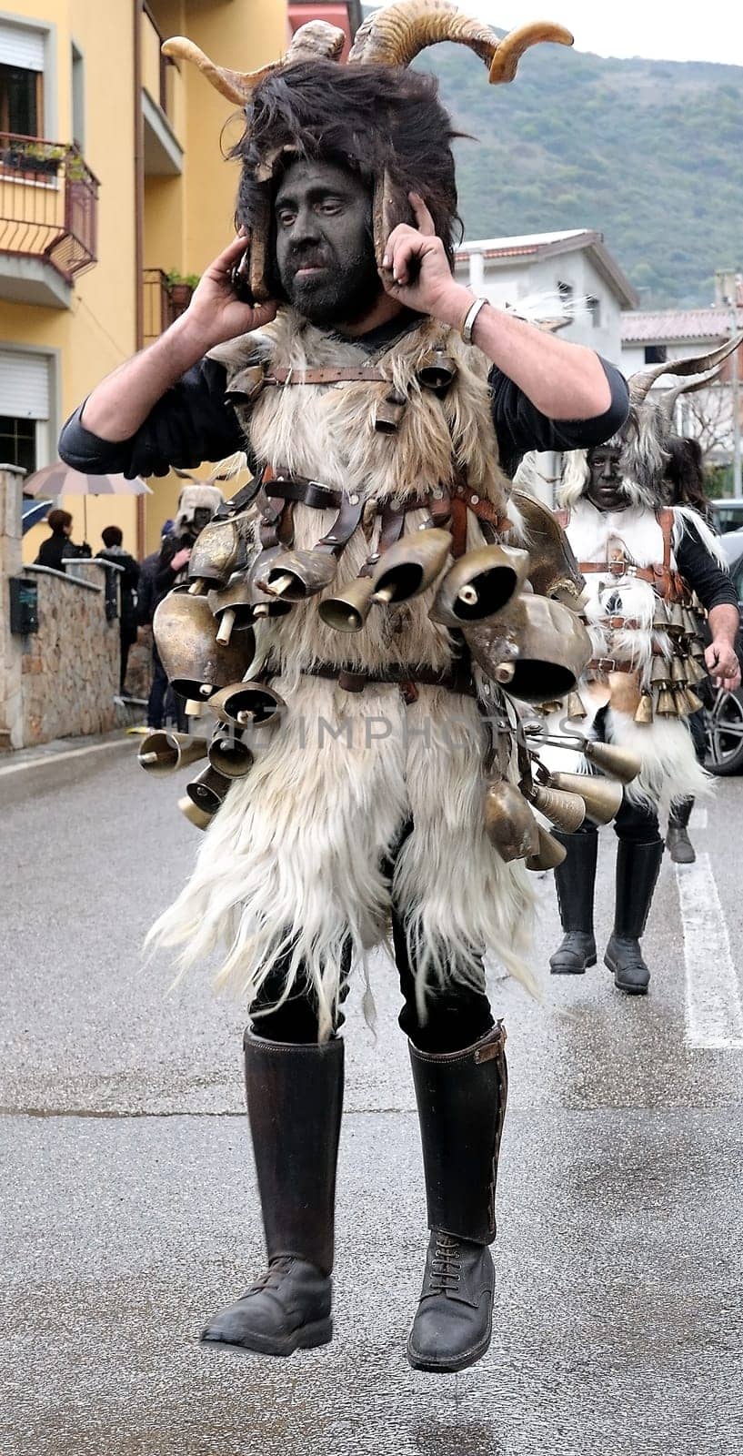 Orani, Sardinia, Italy - February 15, 2015: Parade of traditional masks of Sardinia during the Carnival 2015 in Orani.