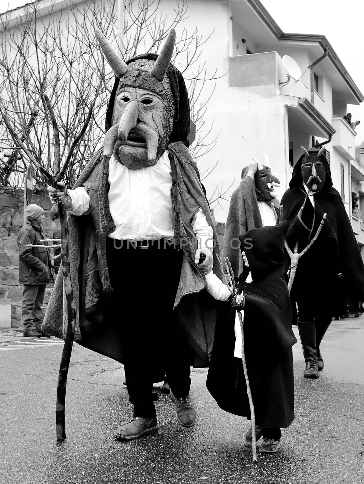 Orani, Sardinia, Italy - February 15, 2015: Parade of traditional masks of Sardinia during the Carnival 2015 in Orani.