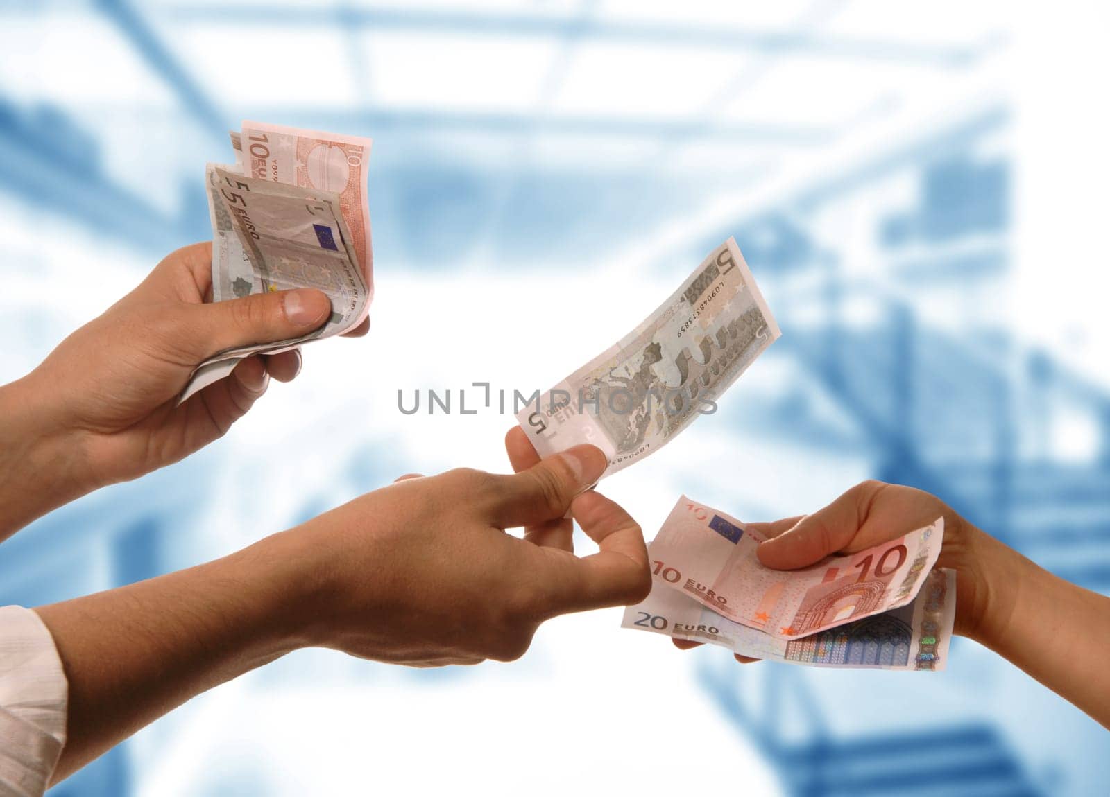 person handing money to another person detail