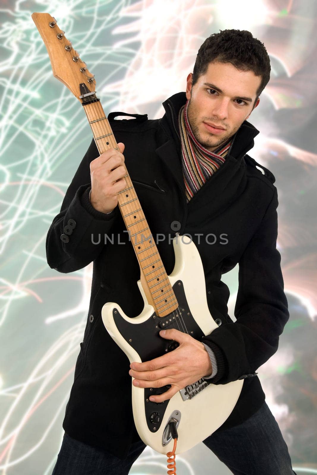young man with guitar at live concert