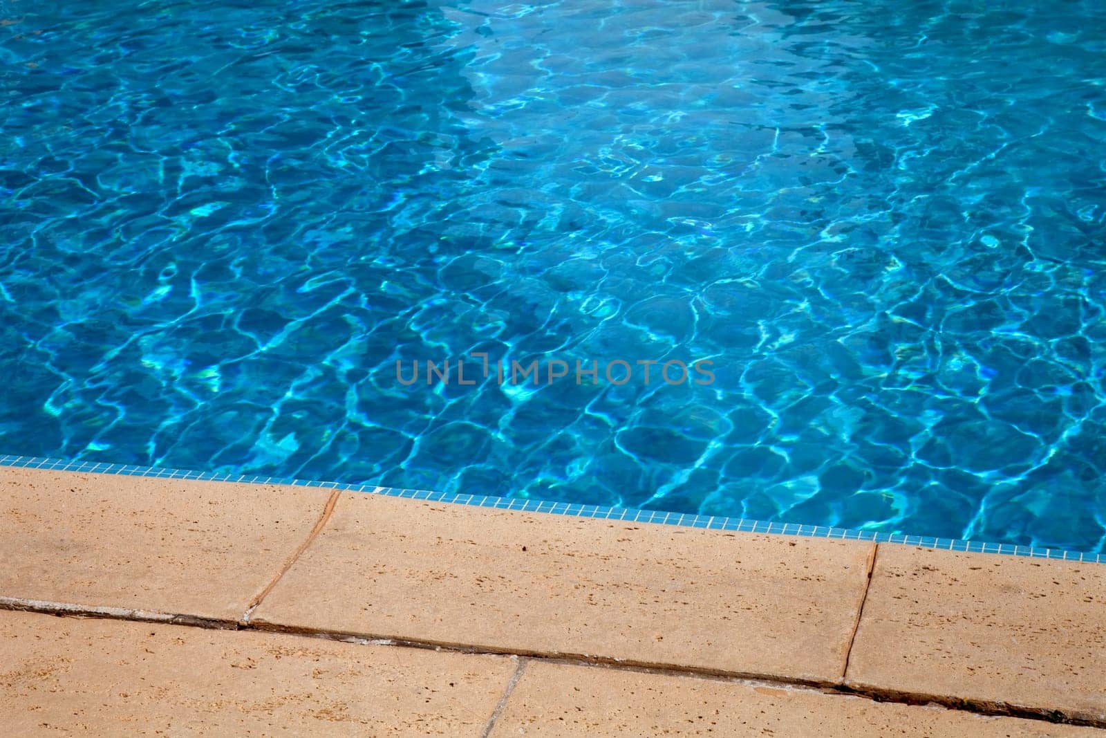 swimming pool blue water detail in summer time