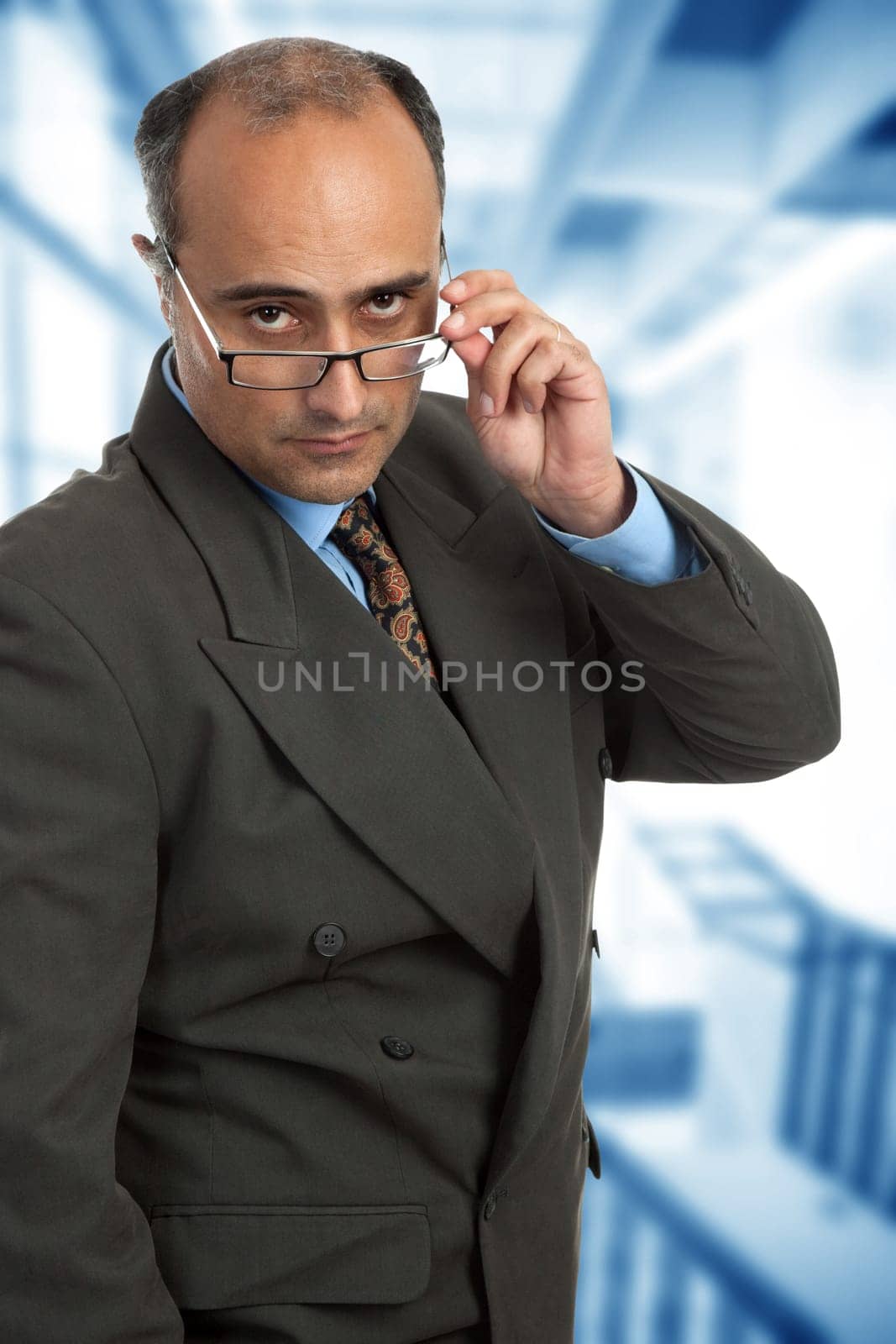 mature business man thinking taking off his glasses