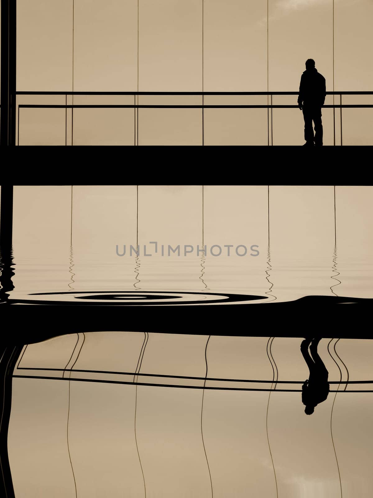 man in the modern building, with reflection