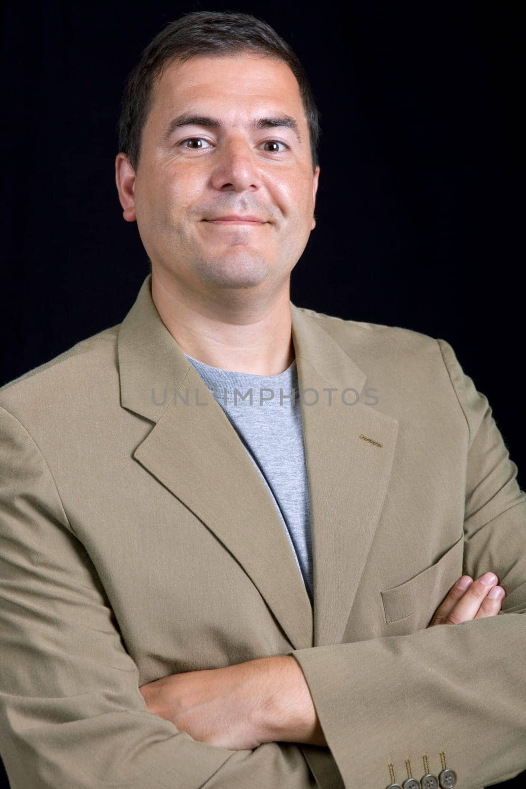 young casual man portrait on a black background