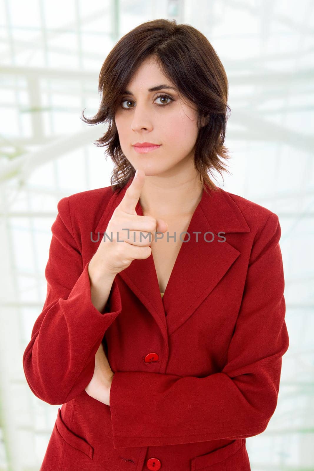 young business woman pointing at the office
