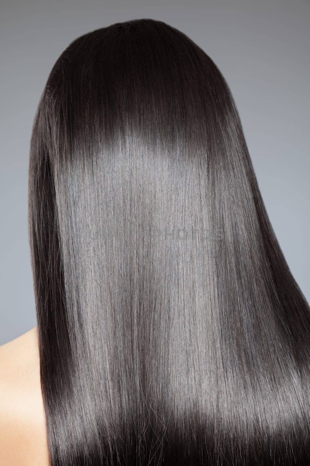 Back view of a woman with long straight hair