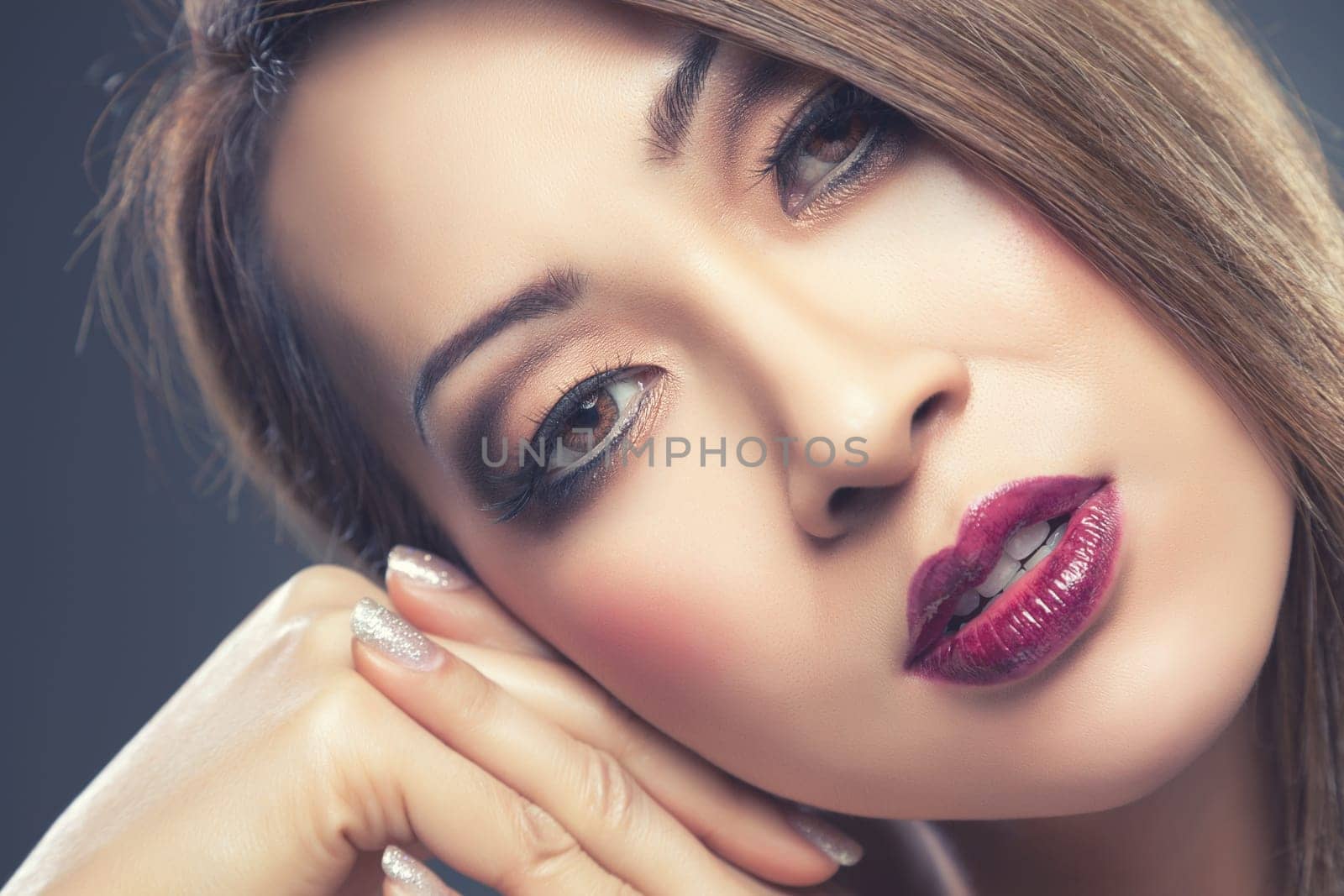Beautiful young Thai woman with makeup and nails done
