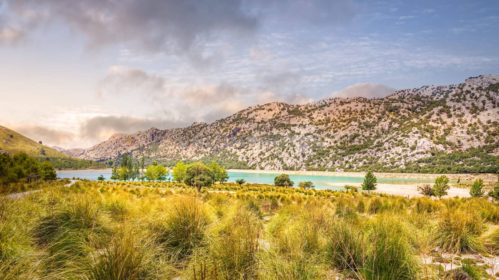 Embassament de Cuber is an artificial turquoise colour lake, water reservoir, located at the valleys of Puig Major and Morro, Sunset, Mallorca, Spain