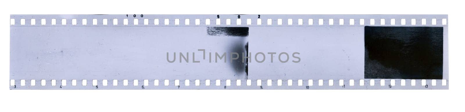 Strip of old celluloid film on white background