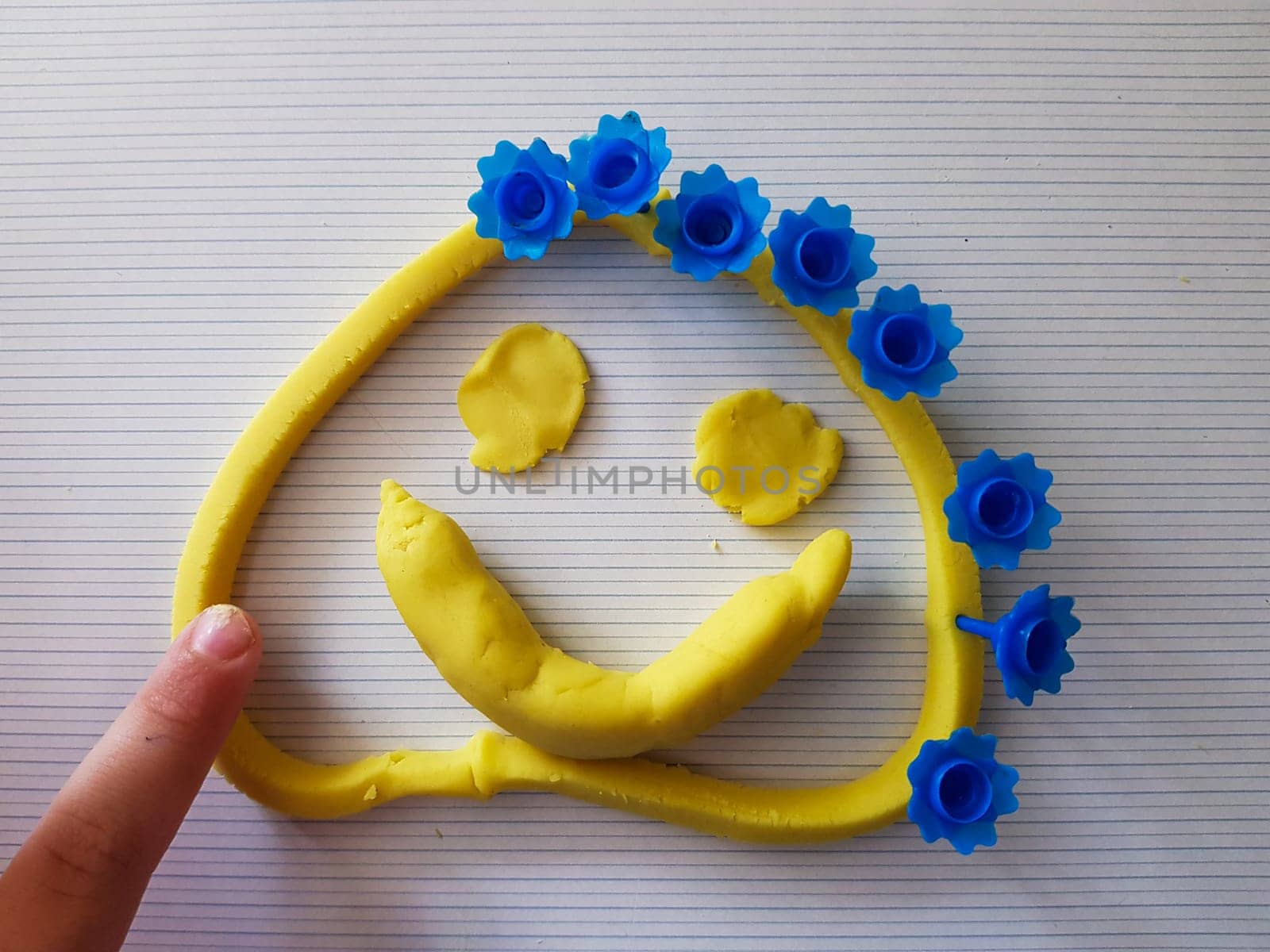 Fanny face made of a modeling clay. Made by child.