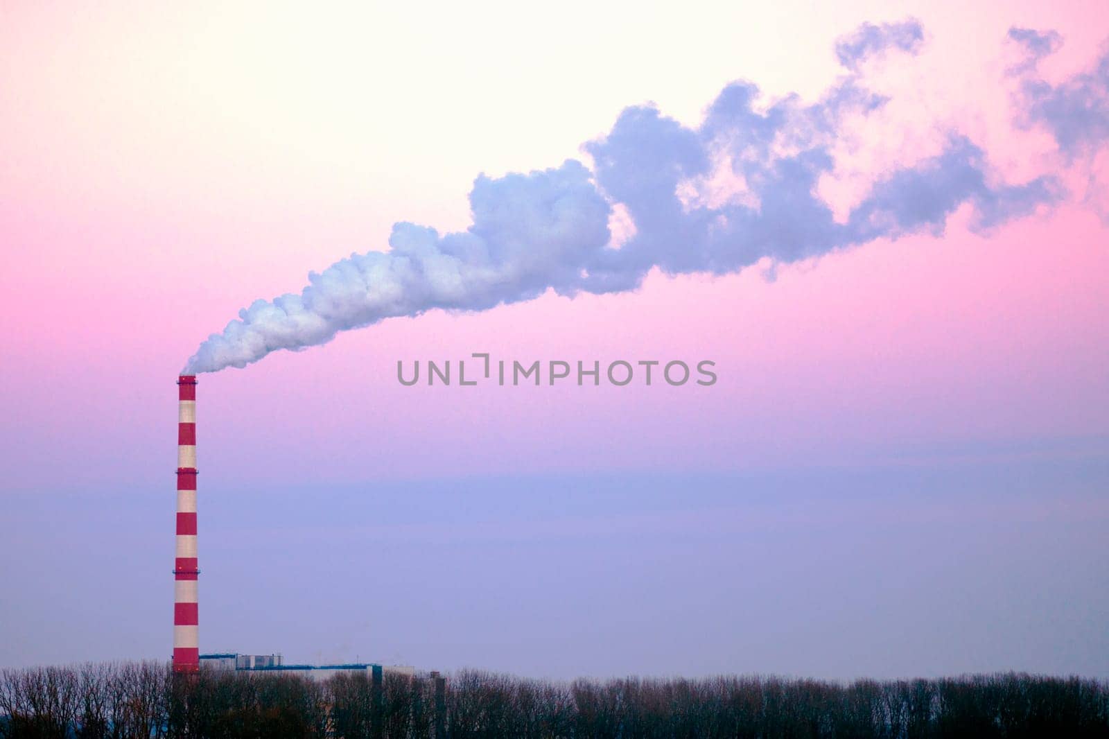 The smoke is flying in the air from chimney of factory, damaged environment concept.