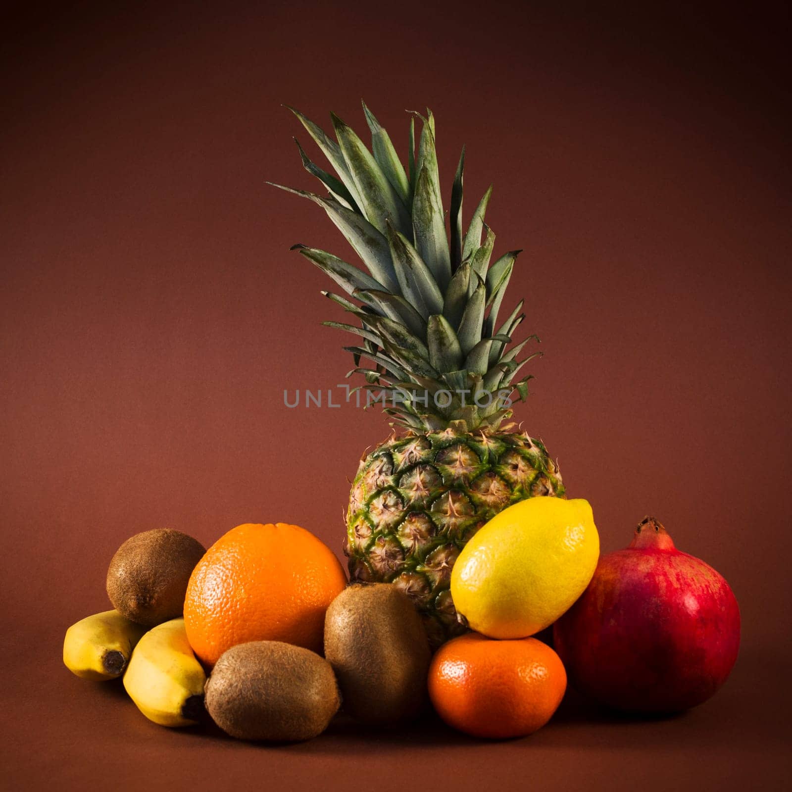 Some exotic or tropical fruits are on brown background.