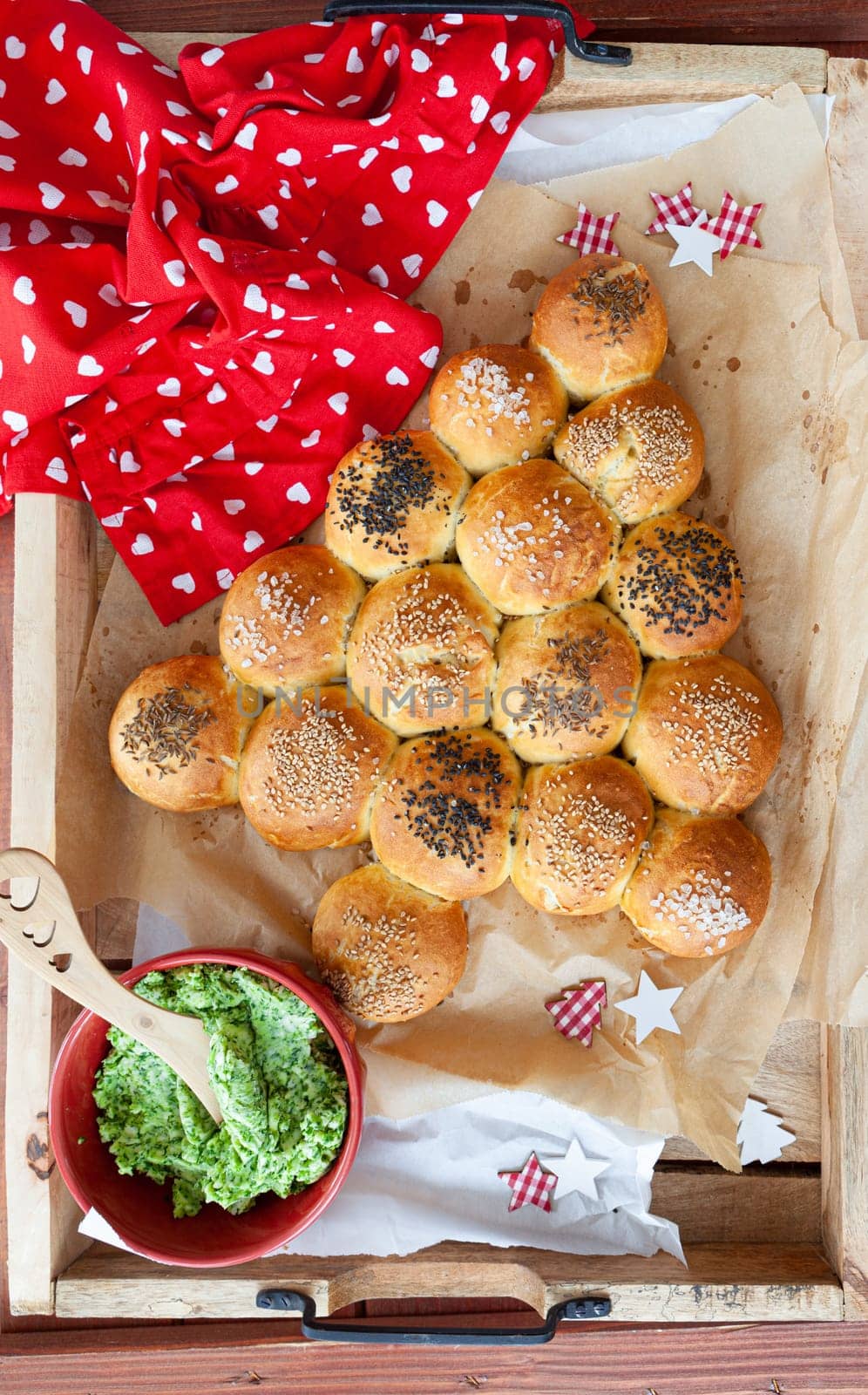 Crispy homemade bread rolls in shape of a Christmas tree
