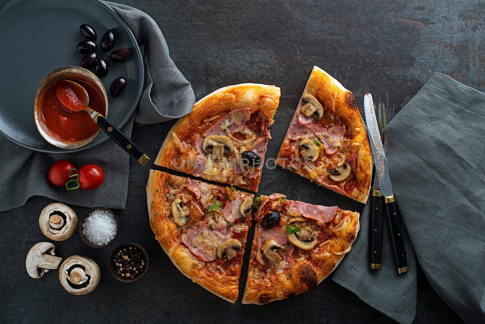 Pizza ingredients served with mozzarella cheese, ham, mushrooms and tomato sauce