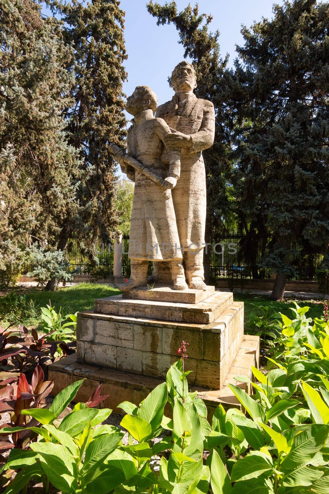 Volgograd, Russia - August 26, 2019: Sculptures of scientists by astronomers in the garden near the building of the Volgograd Planetarium