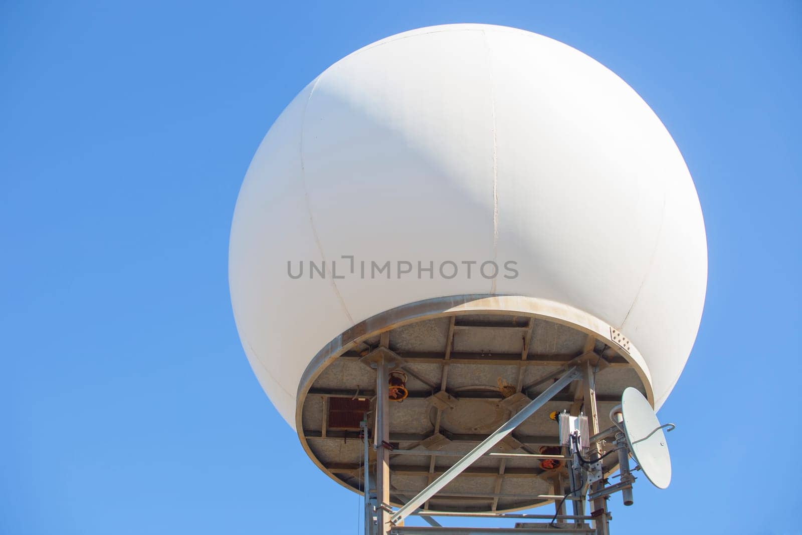 Meteorological radar station on the top of Sierra de Fuentes, Spain. Dome over blue sky
