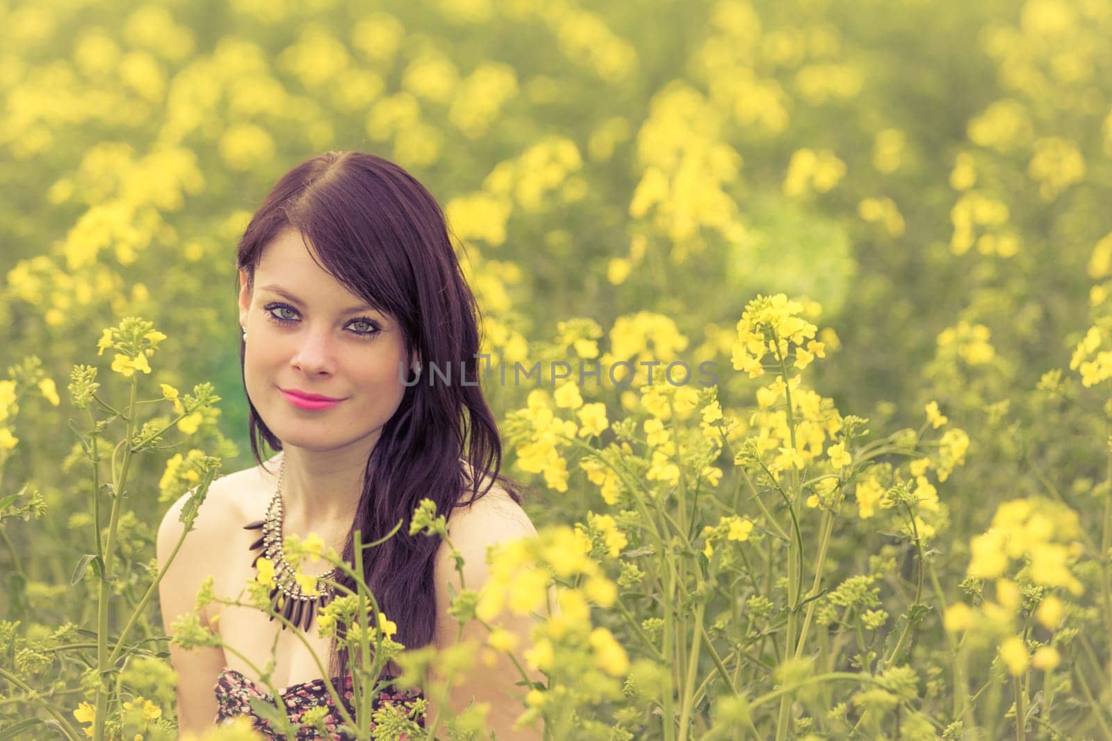 Attractive young beauty girl enjoying the warm sunny sun in nature takes time feeling sustainability contemplation and youth wellbeing