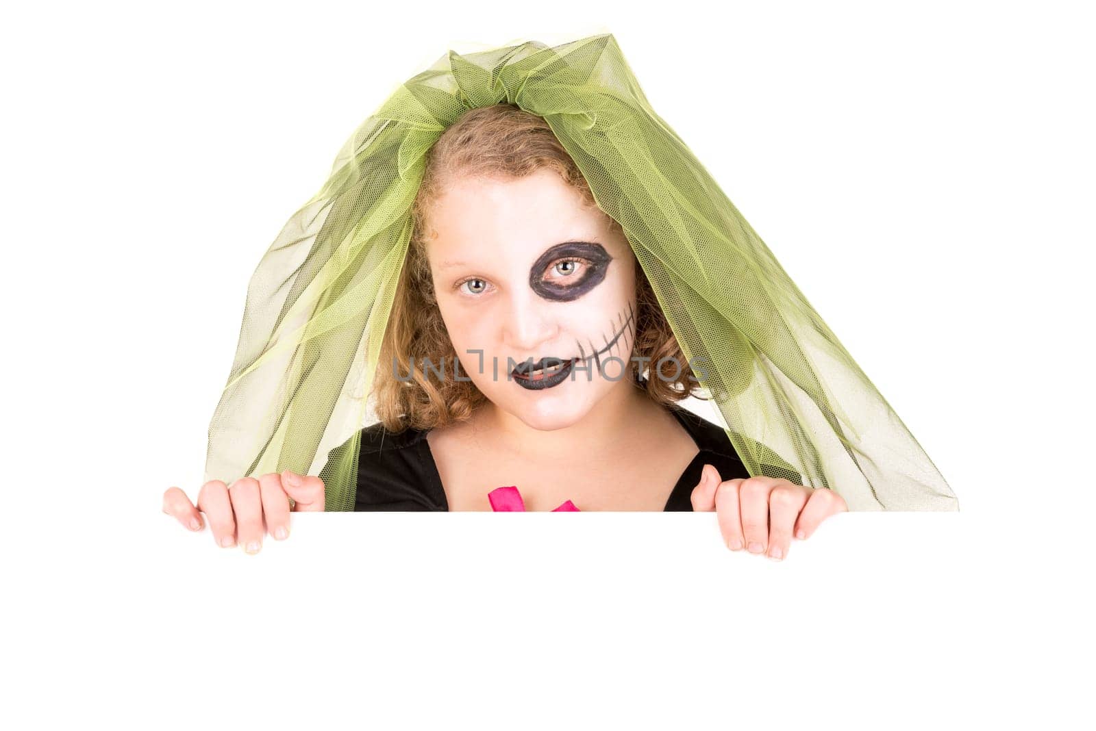 Girl with Halloween costume over a white board