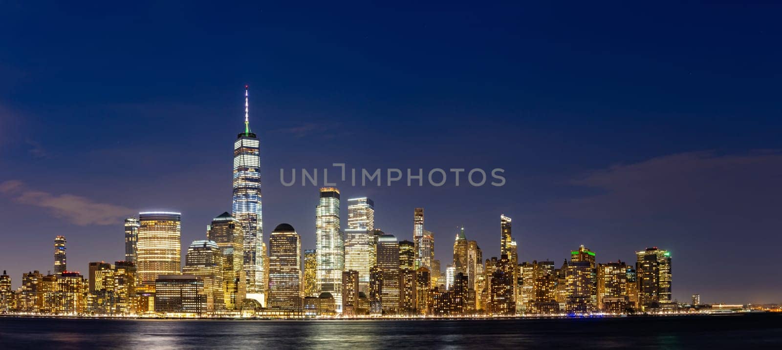 New York city Lower Manhattan skyline cityscape at dusk from New Jersey.