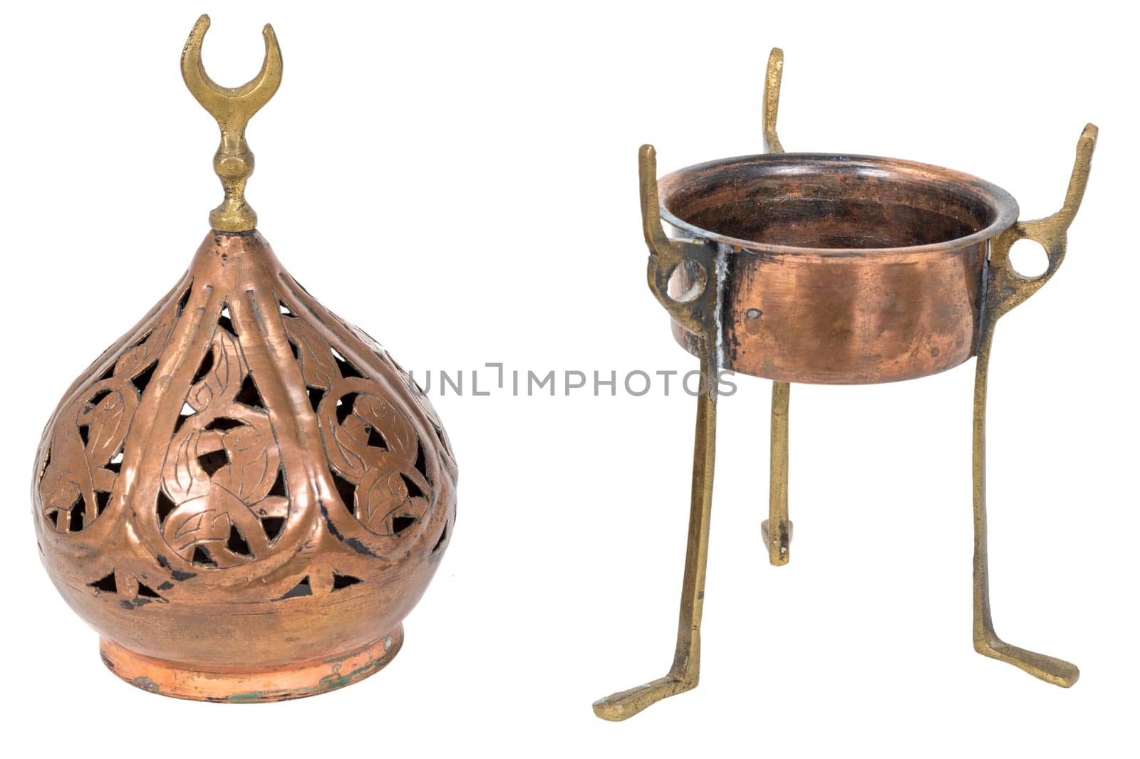 Old oriental incense burner made of copper, taken apart in 2 parts isolated on white