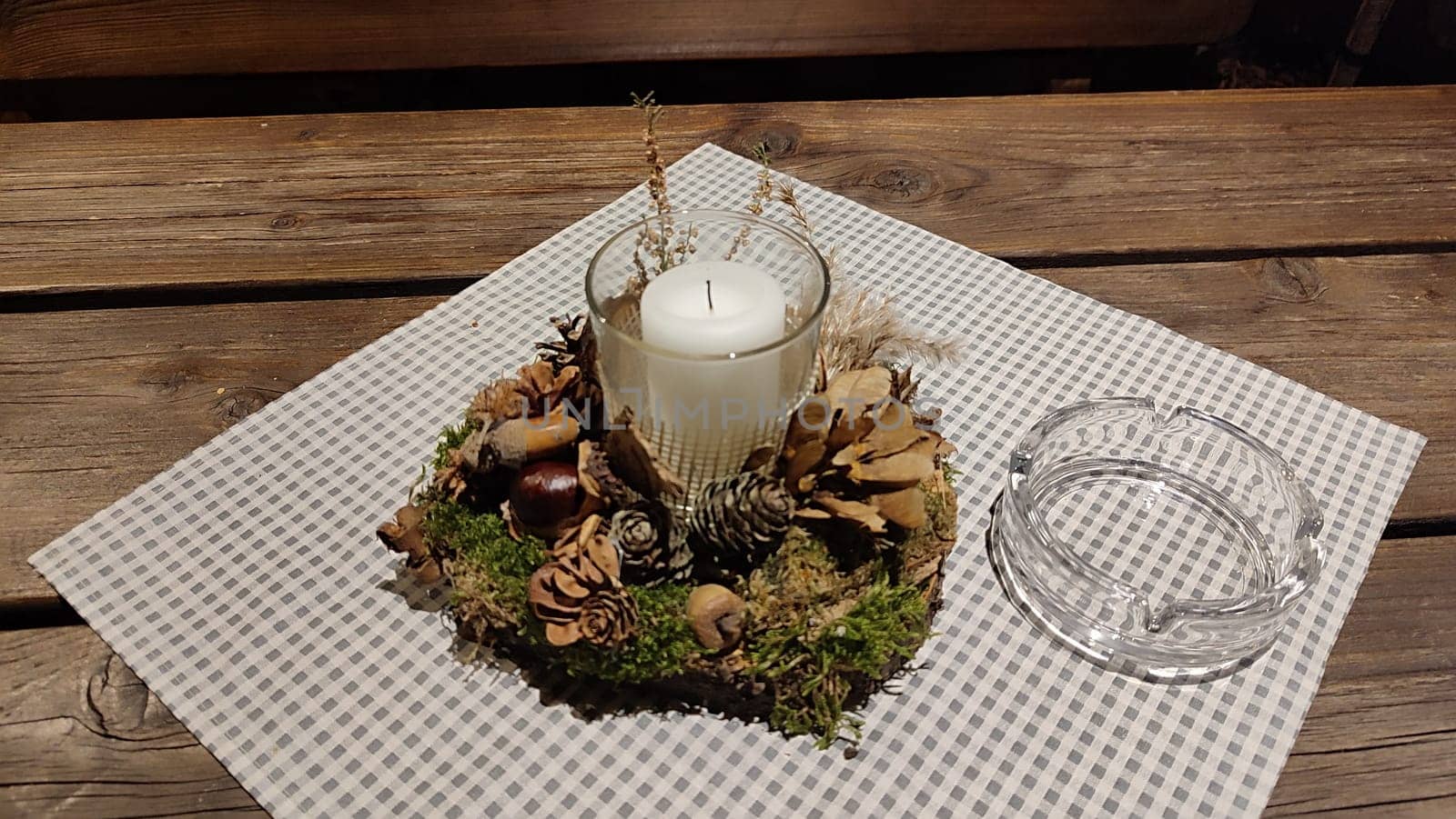 white candle candlestick ashtray wooden table objects. High quality photo