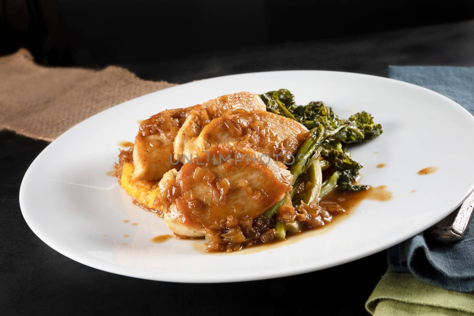 Chicken breast medallions with shallot marsala gravy, polenta and broccoli rabe