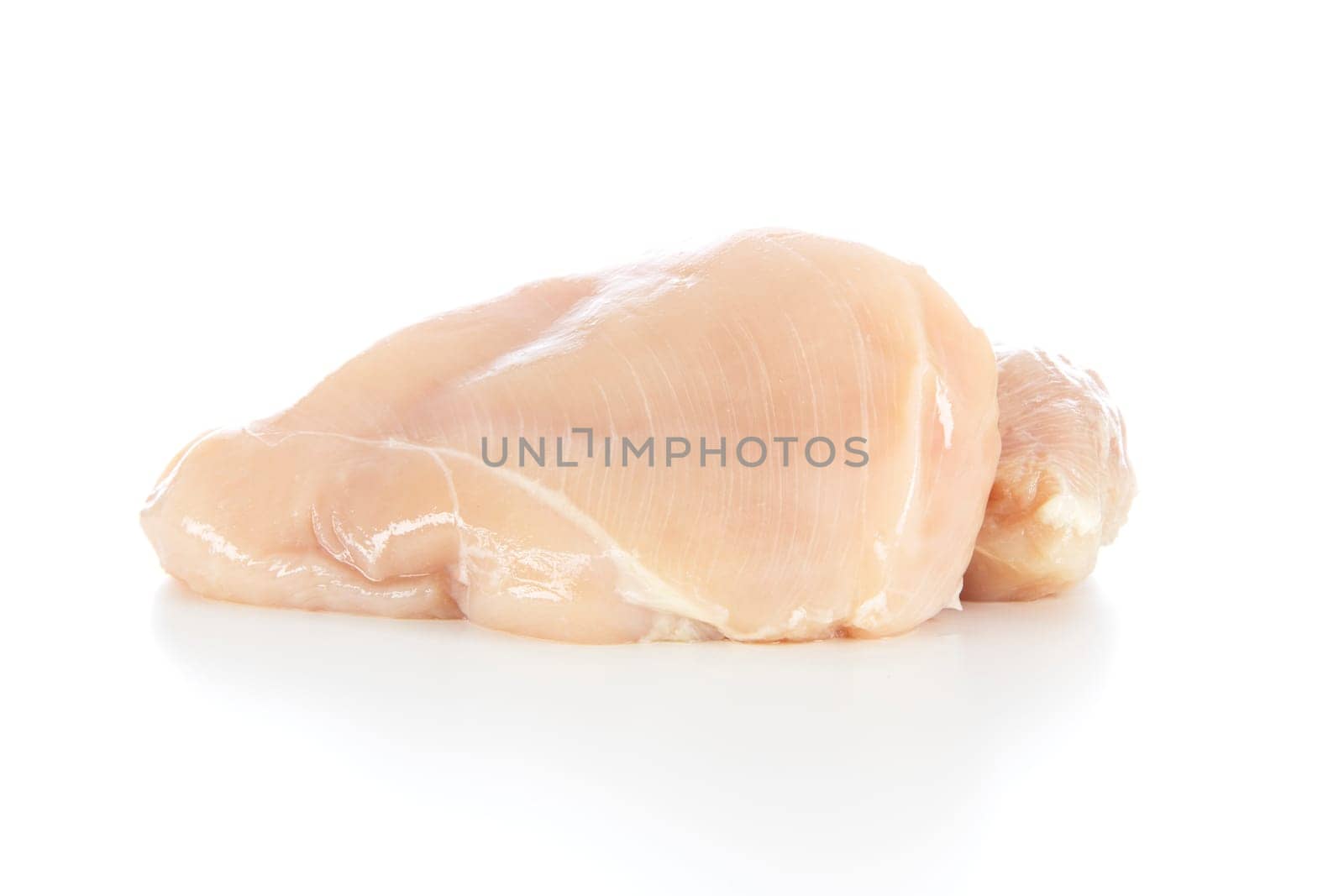 Raw chicken breast isolated on a white background with shadow