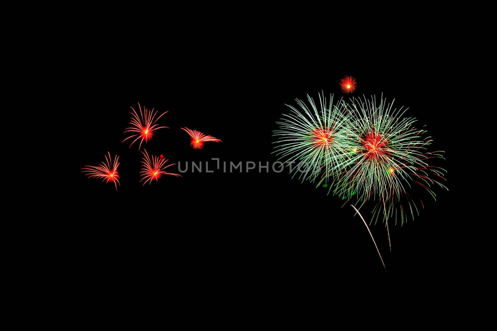 abstract Fireworks light up the dark sky background