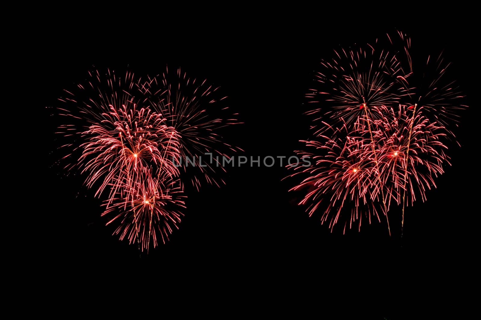 abstract Fireworks light up the dark sky background