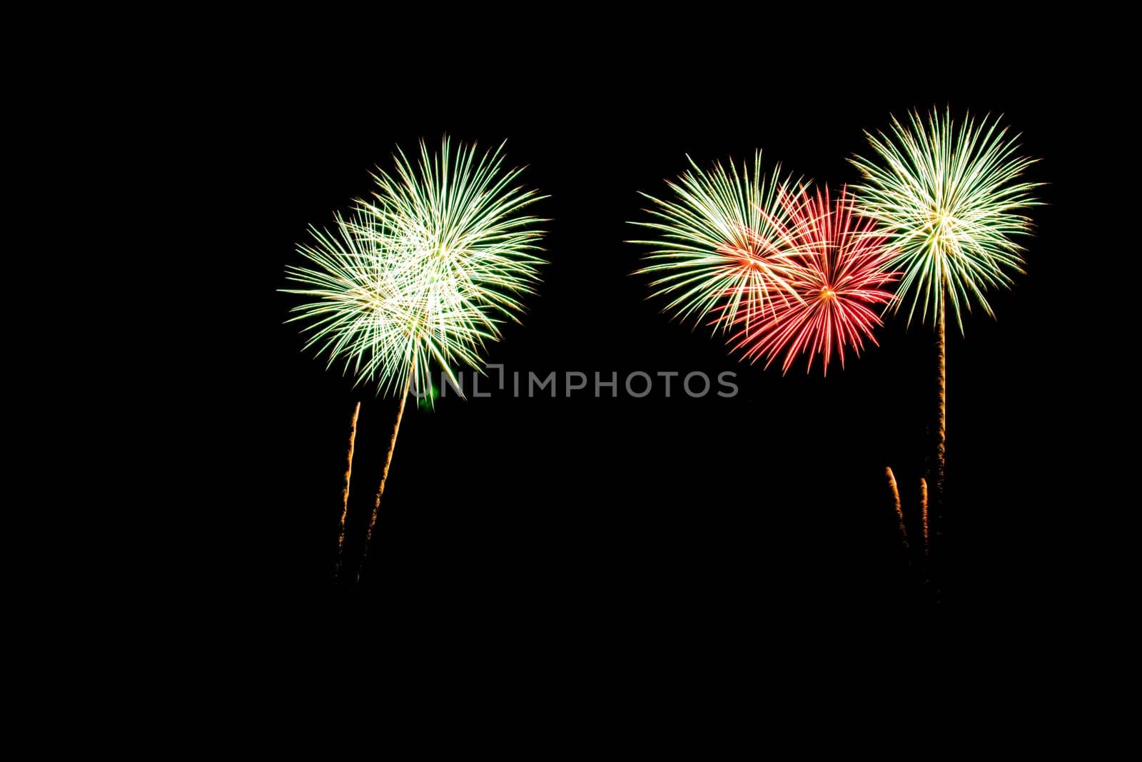 abstract Fireworks light up the dark sky background